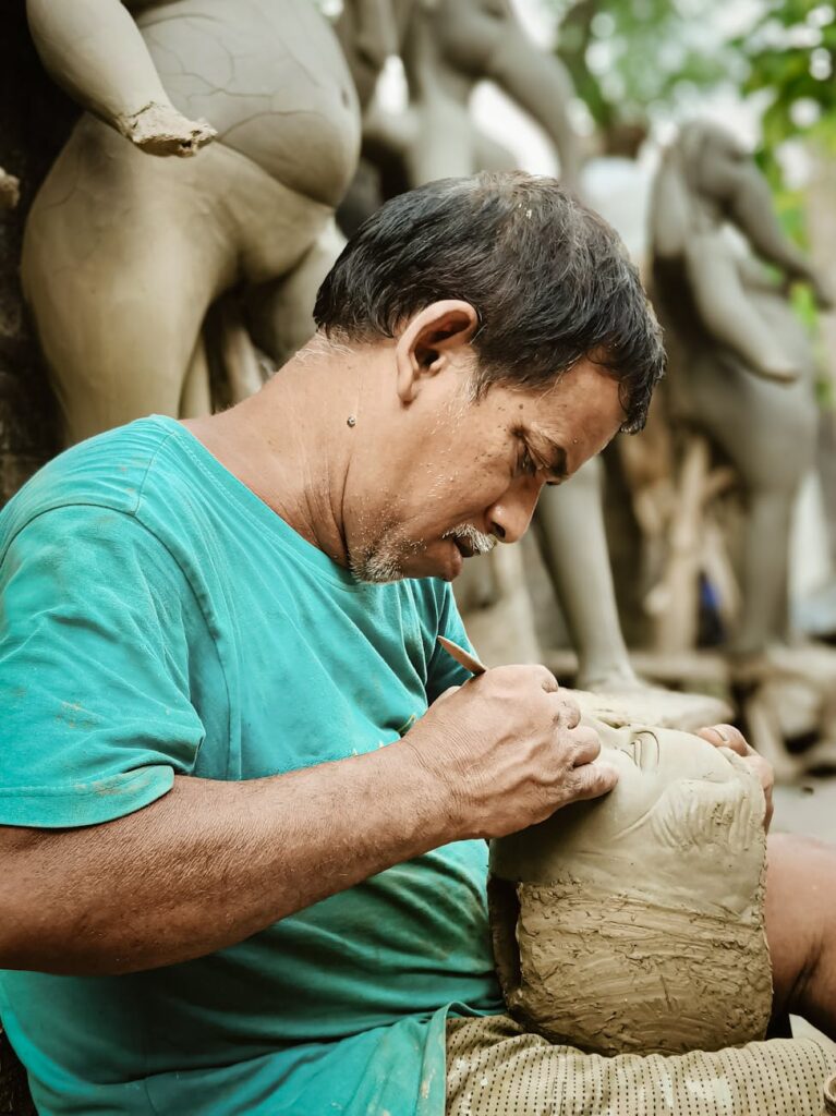 A dimly lit workshop filled with clockwork creations, a toymaker hunched over his workbench.