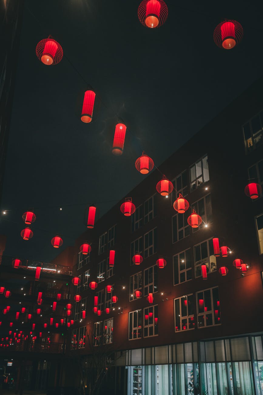 A cityscape at night bathed in an ethereal, otherworldly glow, symbolizing the Symphony of Souls.